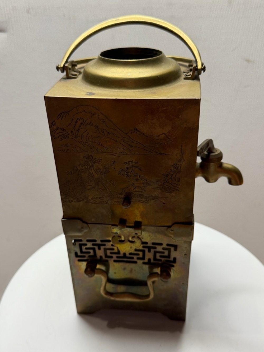An antique Chinese brass samovar or tea canister.